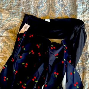 NWT 2 swim skirts Cherry print & solid black